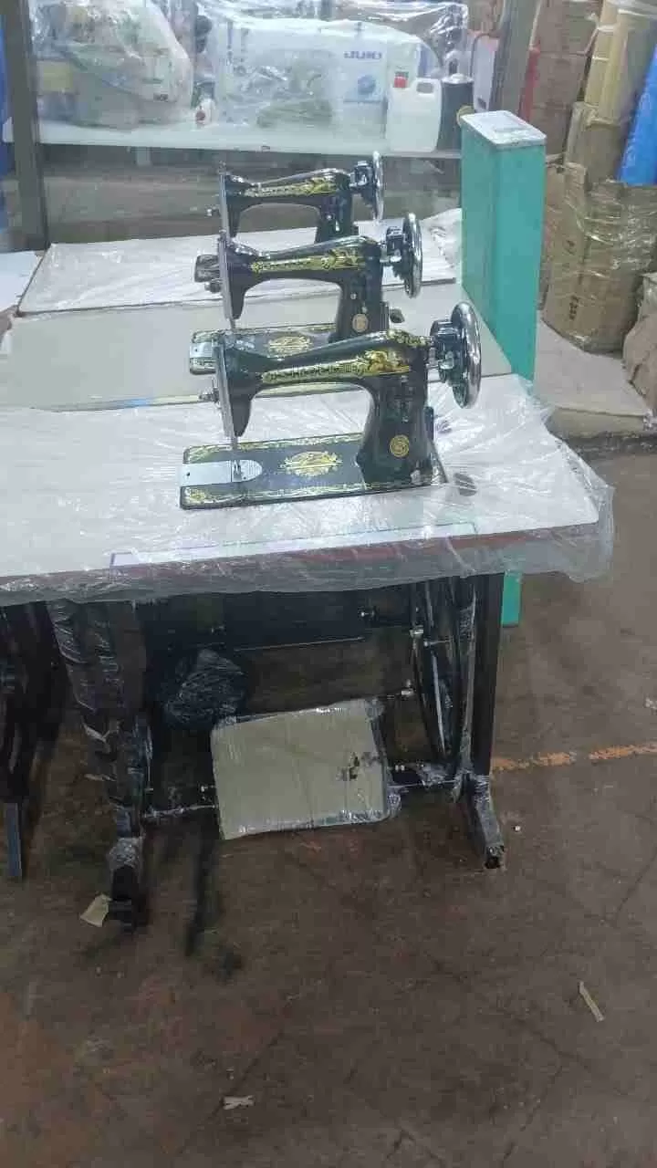 Singer sewing machine with original stand, suitable for stitching, repairs, and crafting.