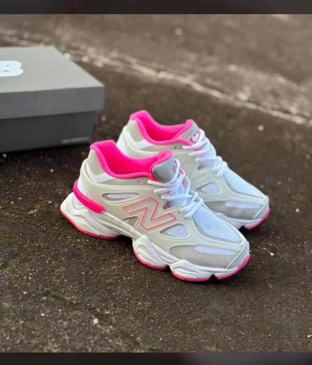 Stylish New Balance sneakers in pink and white with breathable mesh and cushioned sole for comfort a